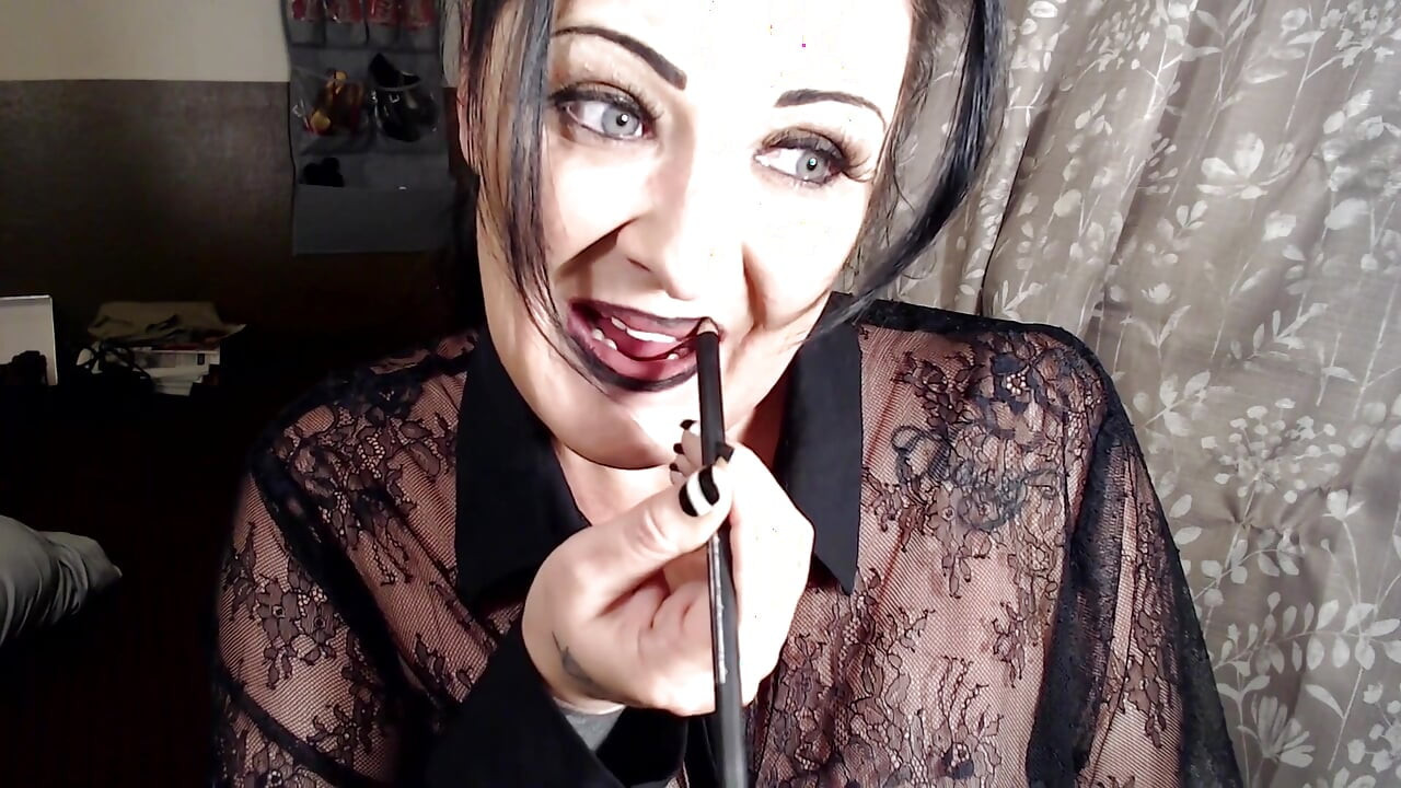 Milf putting on dark red lipstick
