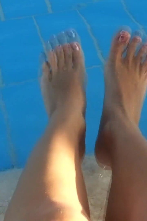 Barefoot Dangling in Swimming Pool Water