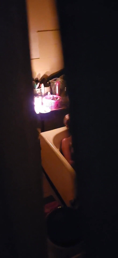 Captivating moment from "Peeping through my neighbours bathroom window,watch how she plays with her pussy"