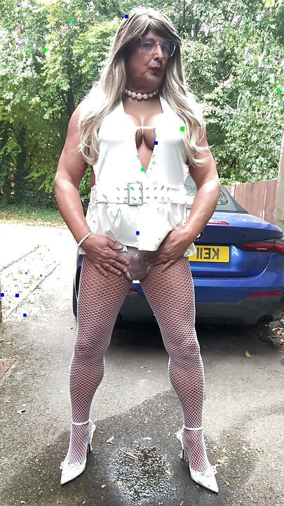Sexy Crossdresser kellycd2022 in sexy white mini dress and fishnet pantyhose and heels