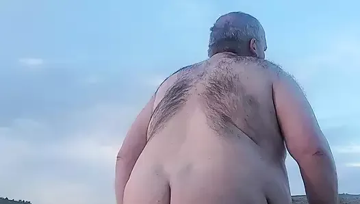 Fat guy naked in the mountains