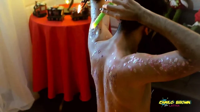 Young Uncut Latino In Colorful Christmas Wax Play With Carols In The Back