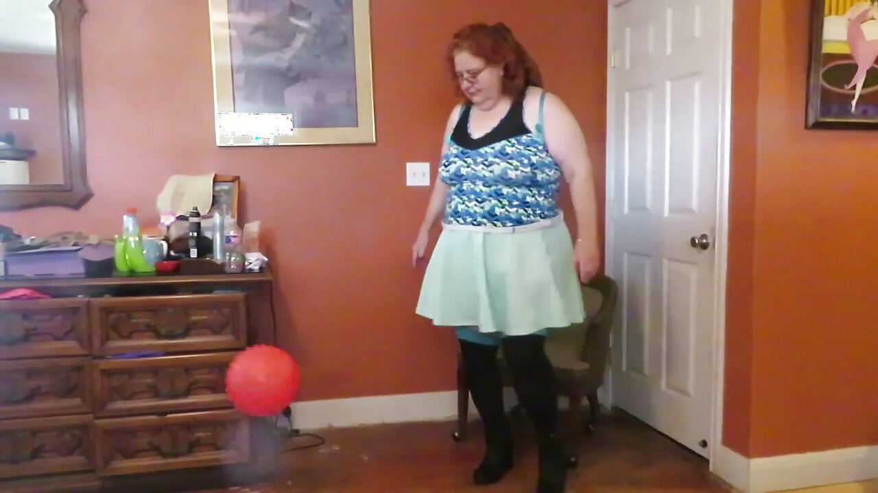 Nurse Vicki  plays with a rubber ball in a mini skirt, sexy stockings and high heel mini boots