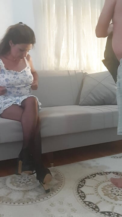 The old man is having sex with his young lover in his lap.