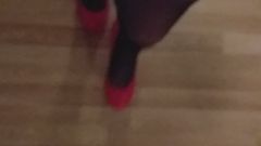 Mystery TS walking in super high heels red shiny stockings
