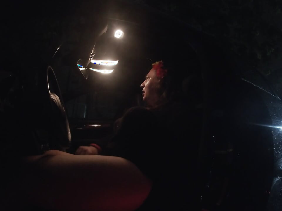 Mature sissy CD out in the rain in A parking lot in public masturbation.