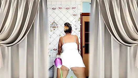 Mature housewife Lukerya twerks her curvy figure in white shorts in the kitchen, hot flirting and teasing movements