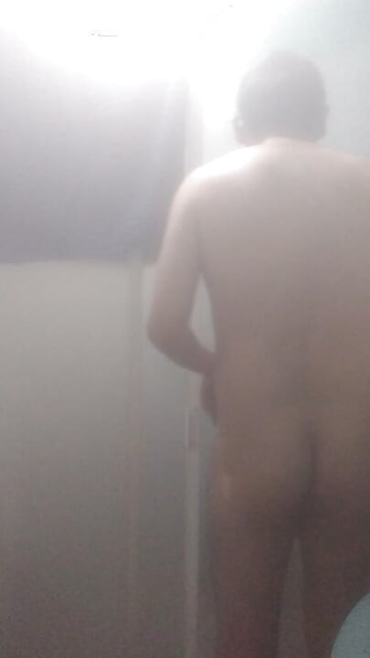 Naked man in shower