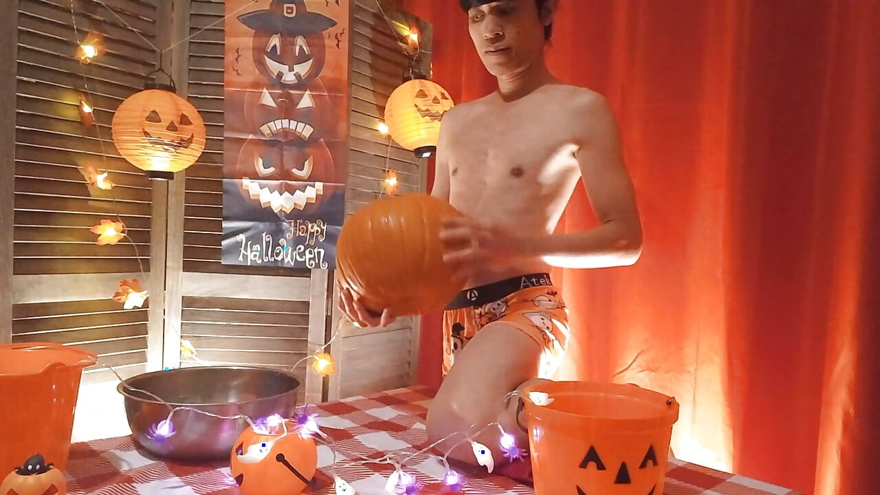 Cute twink Jon Arteen performs a sensual dance while carving a Halloween pumpkin