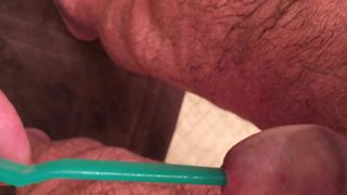 putting toothbrush in cock