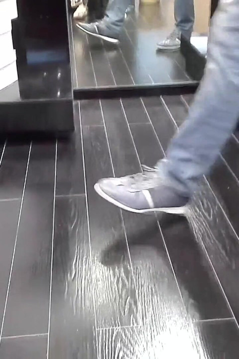 Shoeplay and Dangling in Cute White Flip Flops in a Store