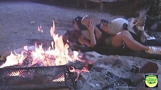 Two Attractive Lesbians Passionately Kiss and Touch Their Pussies Next to the Campfire