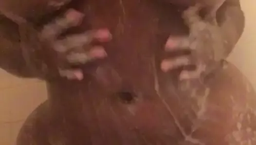 Ass clapping in the shower, after soaping big tits