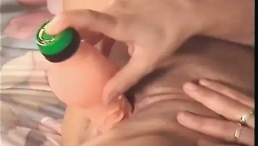 Big titted milf is filling her pussy with a dildo