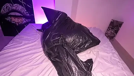 Girl in Garbage Bag Plays with Her Breath