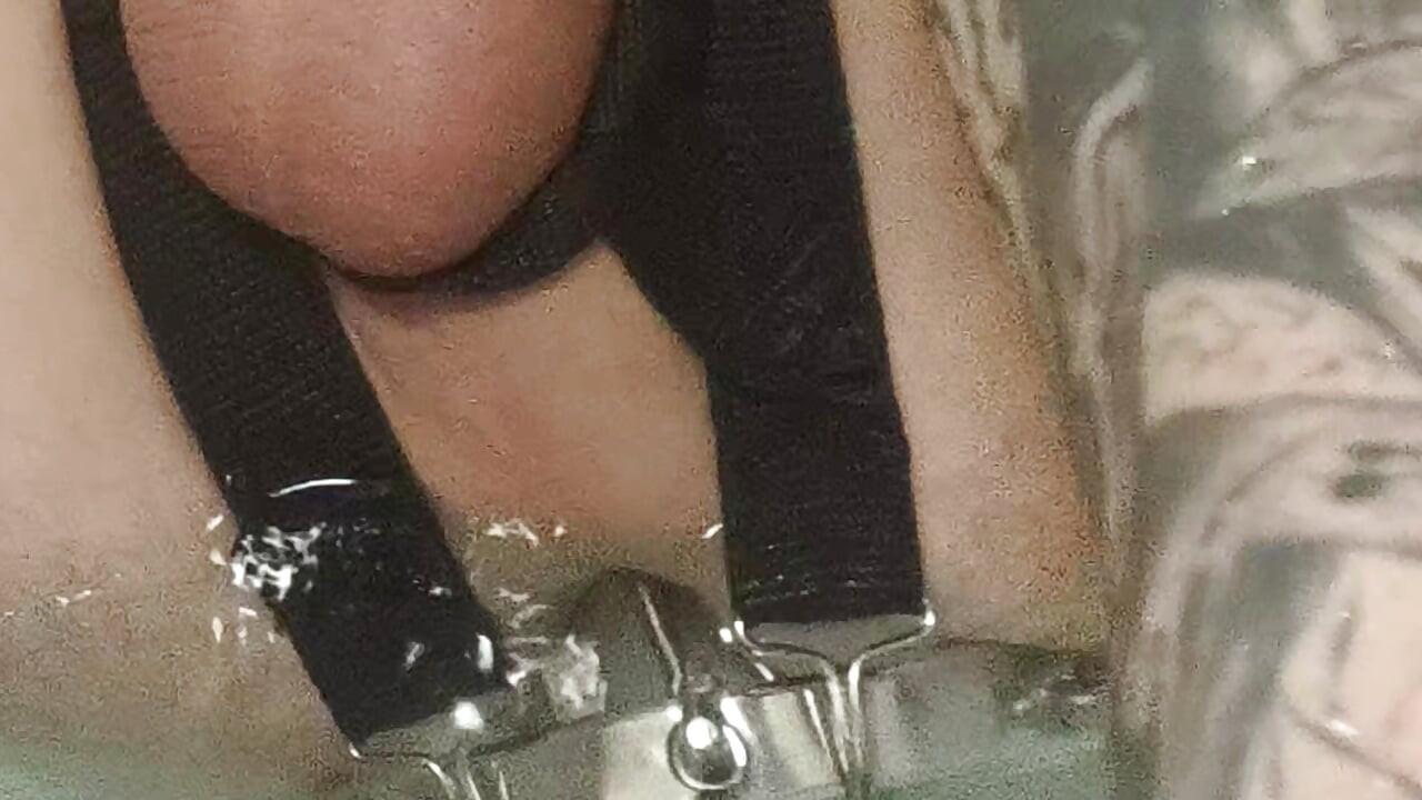 Enema, anal shower. Close-up view through anal mirror. Anal with water. Filling anal with water