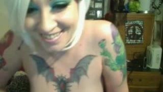 Big tits blonde with tattoos teasing