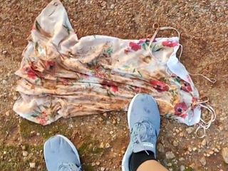 floral 10 dress in mud puddle and then clean shoes on it