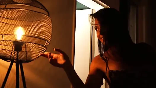 Sensual Latina Doing a Striptease in Low Light