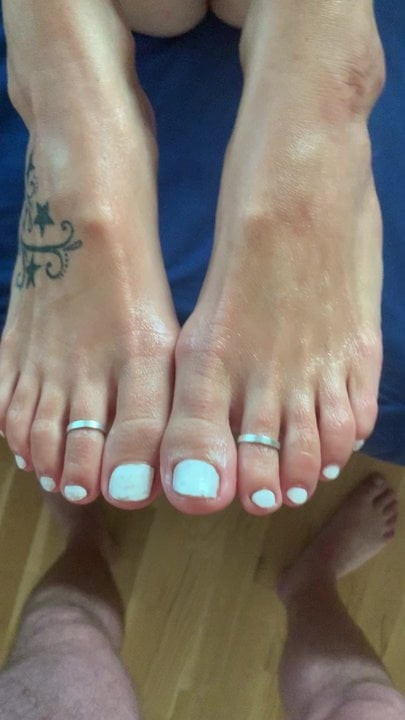 Footjob with cum at her tits