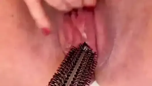 Horny American BBW fucks pussy with hairbrush until creamy