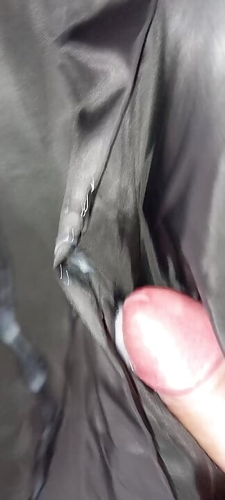 Ejaculating on the lining of her black leather coat