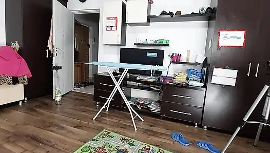 Sexy brunette doing naked chores around the house.