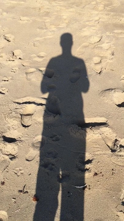 walking in shadow in beach Santa Cruz
