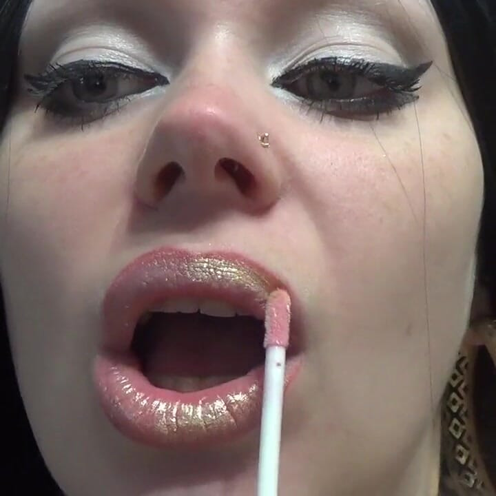 Golden lips teasing and lollipop sucking and licking