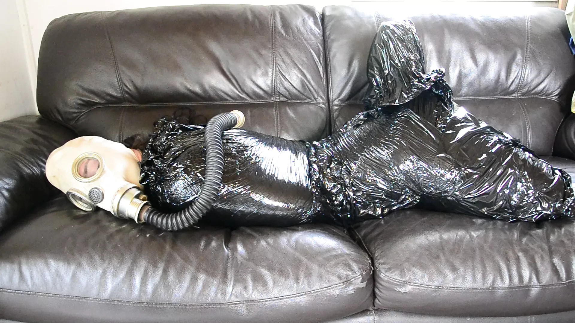 Plastic bondage - girl in gas mask