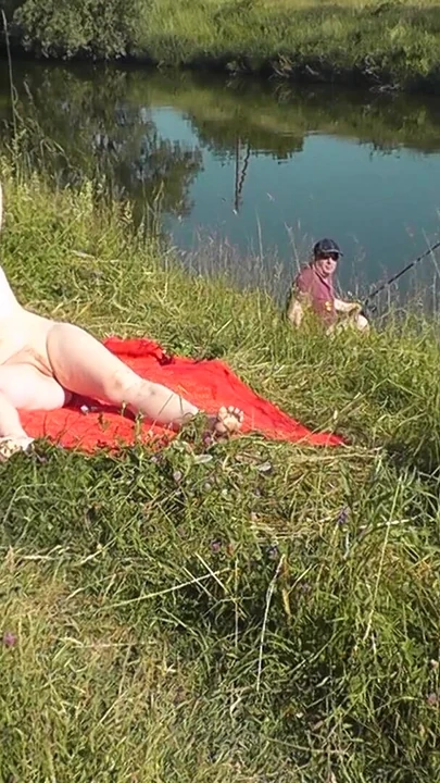 Iconic moment from "Nudist beach. Public nudity. Sexy MILF without panties and bra sunbathes naked is not shy about"