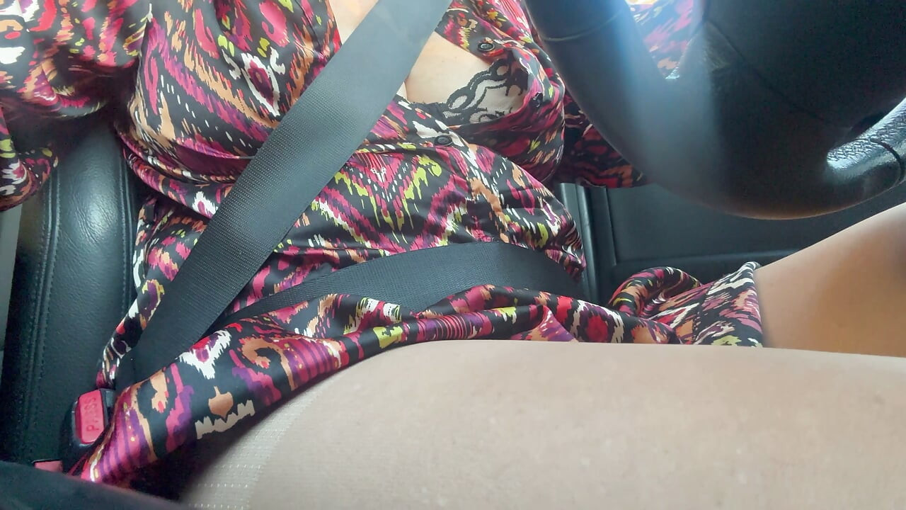 Sexy stepmom drives home and teases us with her big tits, which are practically popping out of her bra.
