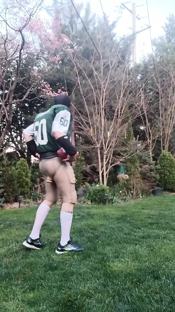 Football jock working out, plugged