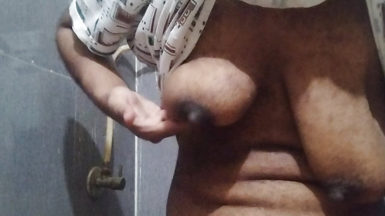 Busty Indian babe playing with her boobs and pussy while peeing