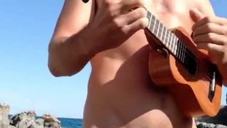 playing the charango on the beach