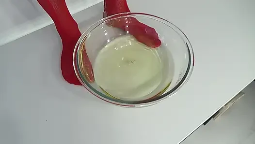 A MILF in Red Is Peeing Into a Basin.