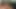 Olgun lateks dominatrix tasmalı çıplak kölelere komut veriyor