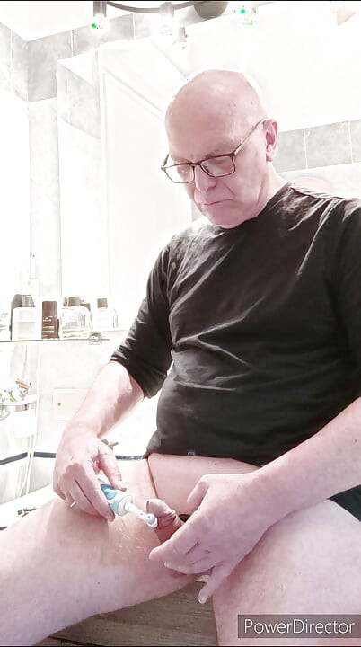 small caged cock and toothbrush