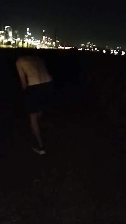 Naked Walking on the Hill Along Highway