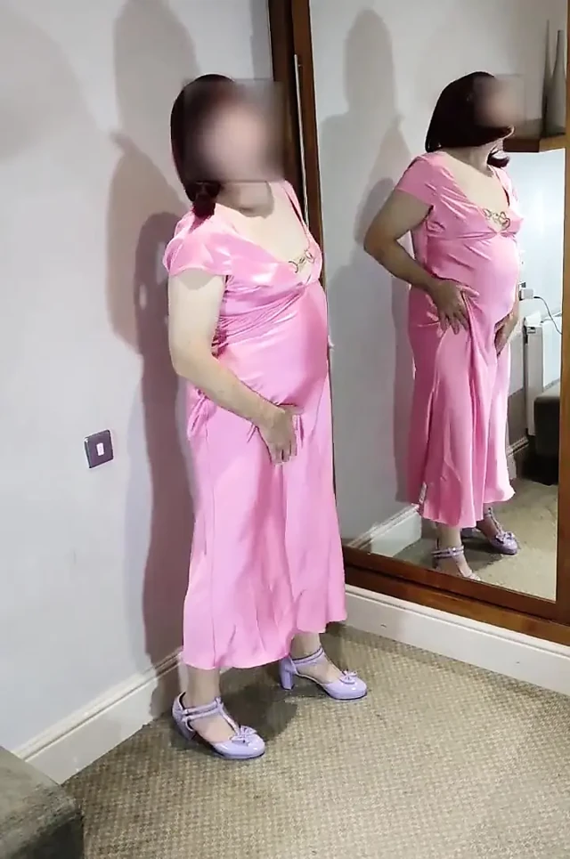 Sexy crossdresser in gorgeous pink satin ball gown
