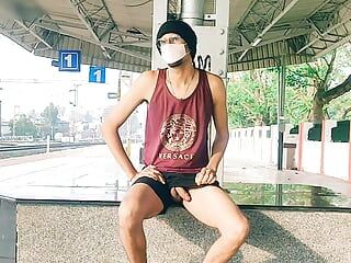 Tall sexy gay boy having fun with dick at railway station