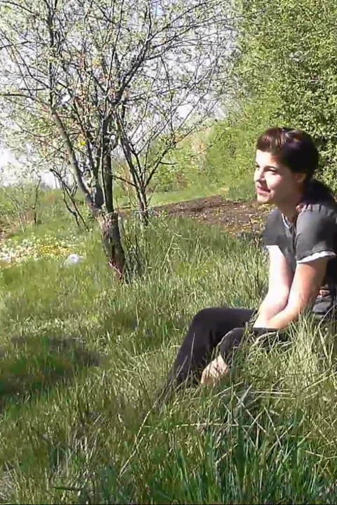Pissing in grass on the side of the road