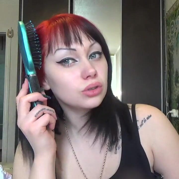 Brushing my hair with little and big brush and by long nails
