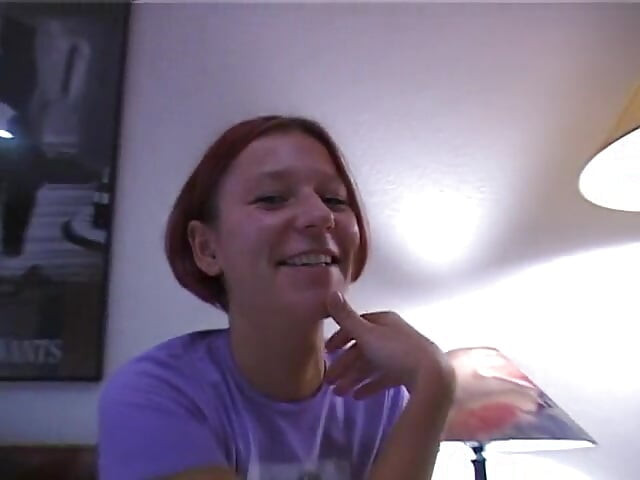 Redhead girl rubs and fingers her wet twat