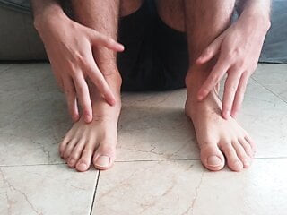 Hot white massaging his feet. Foot fetish