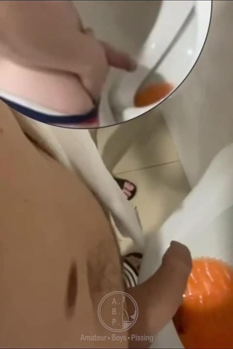 Filming the Guy Peeing Next to Me at the Urinal of the Pool Toilets