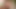 Latina-Transe spielt im Badezimmer mit ihren massiven Möpsen