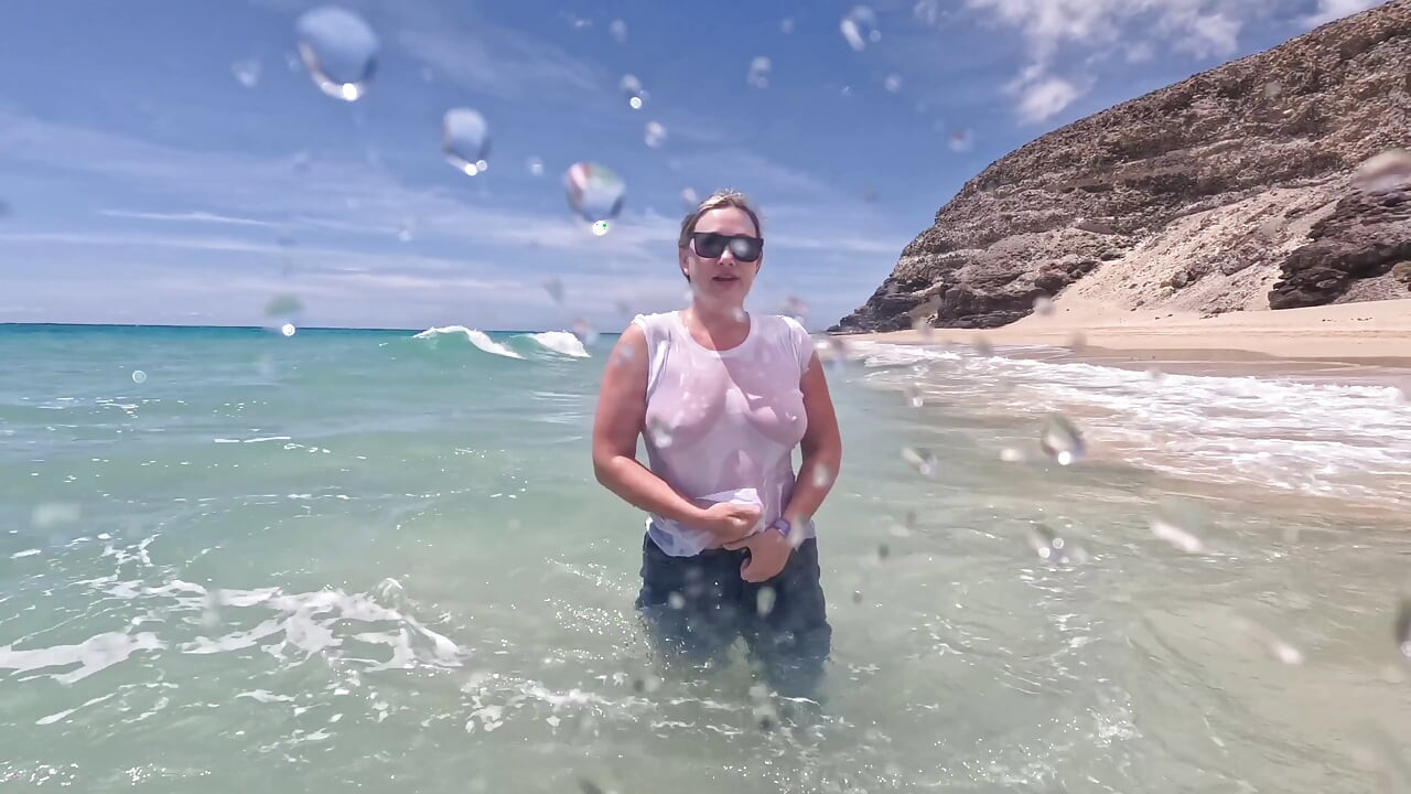 Girl Wetting Jeans in the Ocean and Swimming in Wet White T-shirt