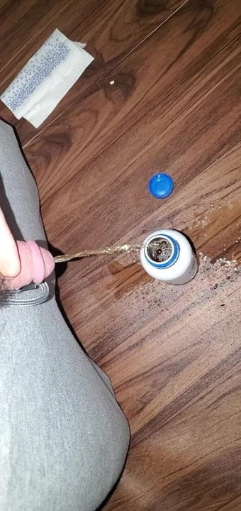 Bored, pissing in a bottle