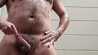 Hairy daddy showers outdoors, cums and then pisses!